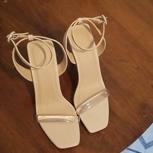 Nude heels with clear toe strap